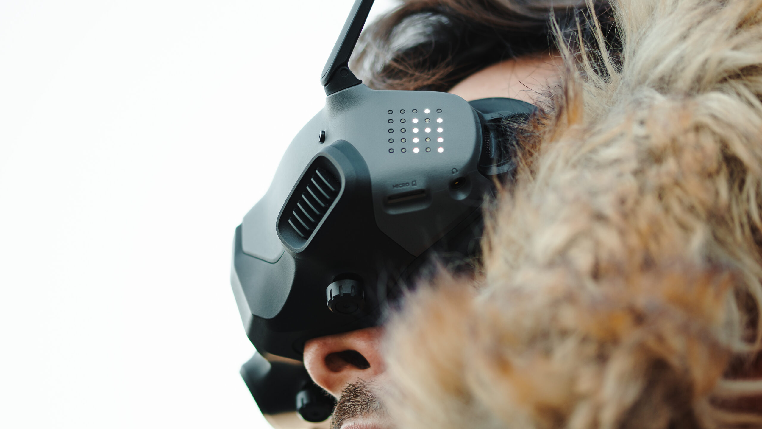Pilot controlling fpv drone through virtual glasses
